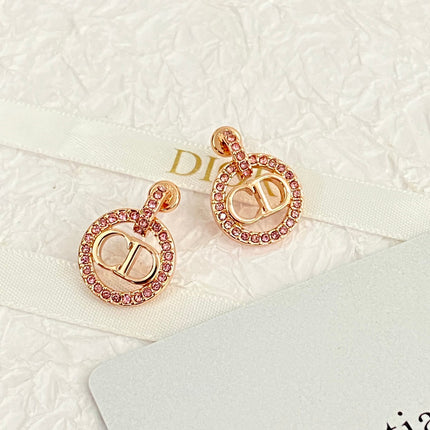 CD 26S CRYSTAL CIRCLE LOGO DROP EARRINGS IN ROSE GOLD TONE METAL 644468