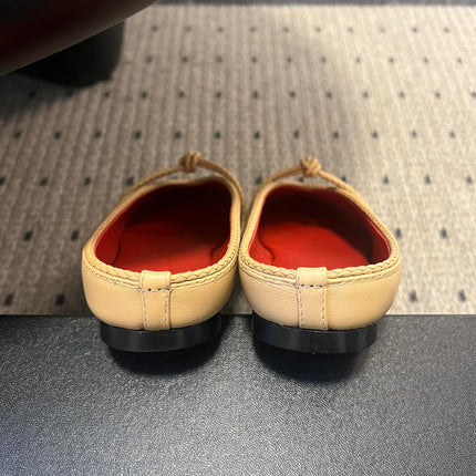 BOTTEGA VENETA 26S FLAT MULES IN BEIGE LAMBSKIN
