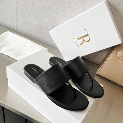 THE ROW 26S FLAT THONG SANDALS IN BLACK CALFSKIN