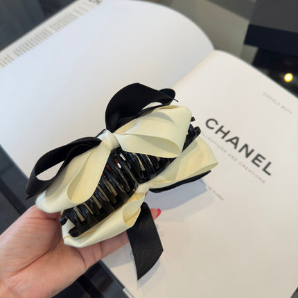 CHANEL 26S BOW HAIR CLIP IN BLACK AND WHITE SATIN 503131