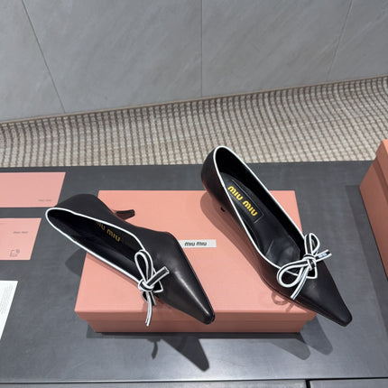 MIUMIU 26S POINTED TOE PUMPS 55MM IN BLACK AND WHITE CALFSKIN WITH BOW