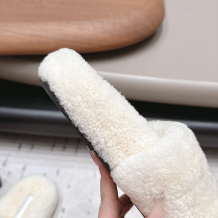 CHANEL 26S SLIDE MULES IN WHITE SHEARLING AND BLACK CC LOGO