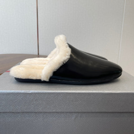 PRADA 25S CLOGS IN BLACK CALFSKIN FUR-LINED
