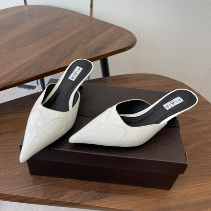 ALAIA 26S HEELED MULES 50 MM IN WHITE GLOSSY CALFSKIN