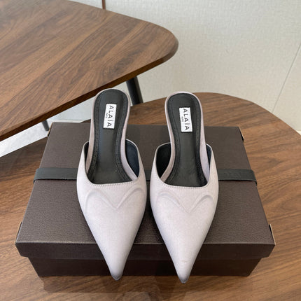 ALAIA 26S HEELED MULES 50 MM IN LAVENDER GREY FABRIC