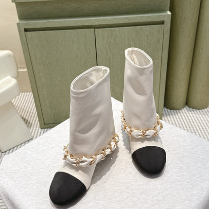 CHANEL 25S CALF-LENGTH BOOTS 45MM IN WHITE AND BLACK CALFSKIN GOLD HARDWARE