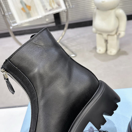 PRADA 25S ZIP-UP ANKLE BOOTS IN BLACK CALFSKIN