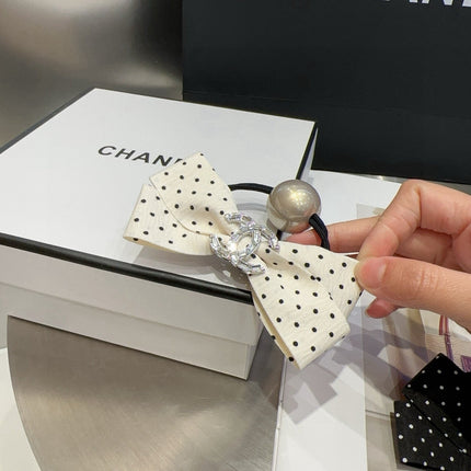 CHANEL 26S BOW HAIR TIE IN BLACK WITH WHITE POLKA DOTS 505301