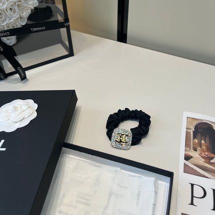CHANEL 26S HAIR TIE IN BLACK FABRIC 503108