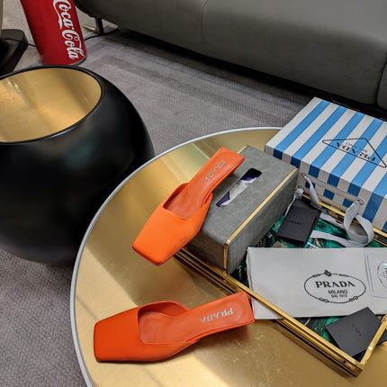 PRADA 26S SQUARE TOE MULES 40MM IN ORANGE SATIN