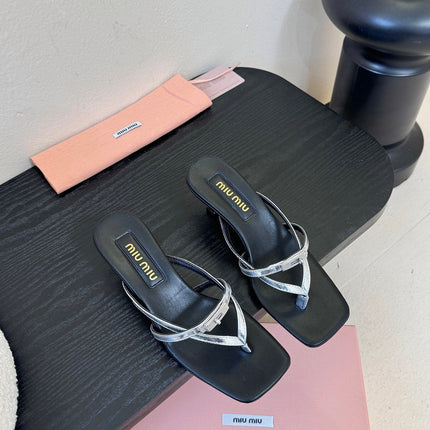 MIUMIU 26S LOW-HEEL THONG SANDALS IN BLACK AND SILVER CALFSKIN