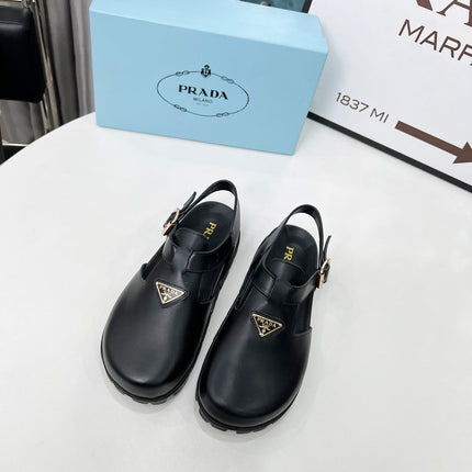 PRADA 26S RUBBER LOGO CHUNKY SOLE FISHERMAN SANDALS IN BLACK CALFSKIN