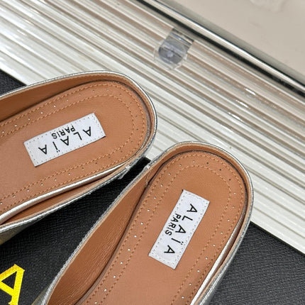 ALAIA FLAT MULE IN SILVER LAMBSKIN