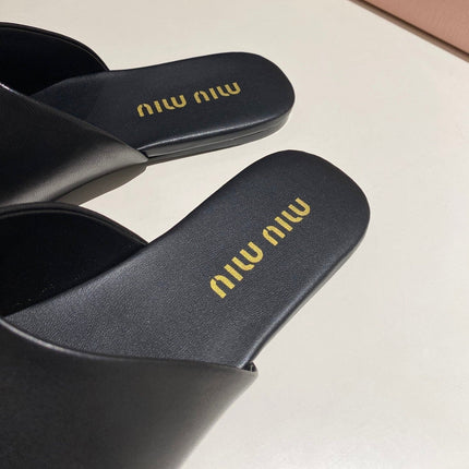 MULES SLIPPERS RETRO BLACK COWHIDE