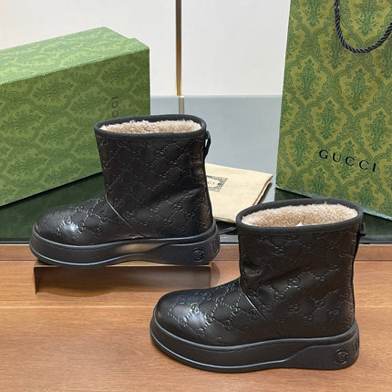 GG UGG BOOTS IN BLACK EMBOSSED SUEDE AND BEIGE WOOL LINING