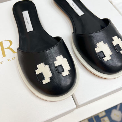 THE ROW 26S PIXEL APPLIQUE MULES IN BLACK CALFSKIN