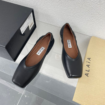 ALAIA BALLET FLATS IN BLACK CALFSKIN