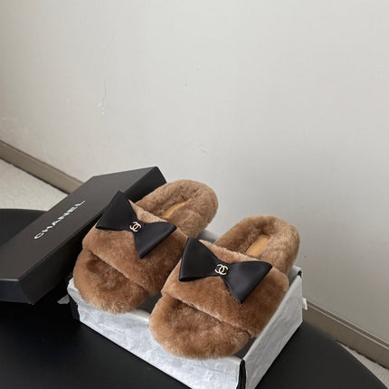 CHANEL 26S SLIDE SANDALS IN BROWN SHEARLING WITH BLACK BOW