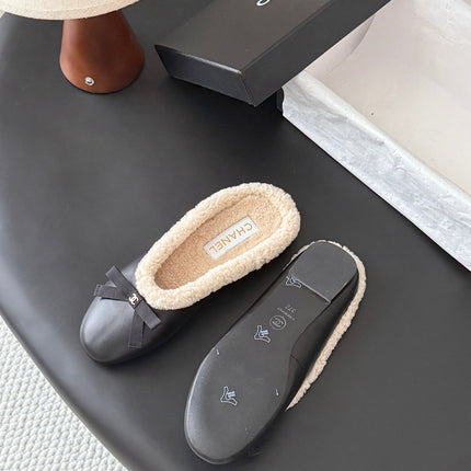 CHANEL 26S MULES IN BLACK LAMBSKIN AND SHEARLING