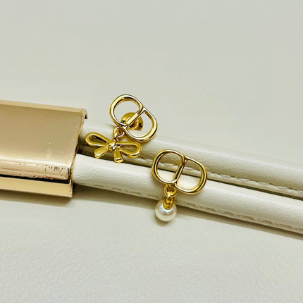 CD 26S MINI BOW PEARL DROP EARRINGS IN GOLD TONE METAL 646612