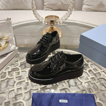 PRADA 26S LOAFERS IN BLACK PATENT CALFSKIN
