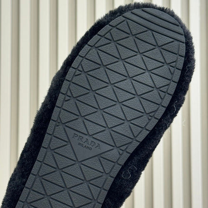 PRADA 25S CLOGS IN BLACK SHEARLING