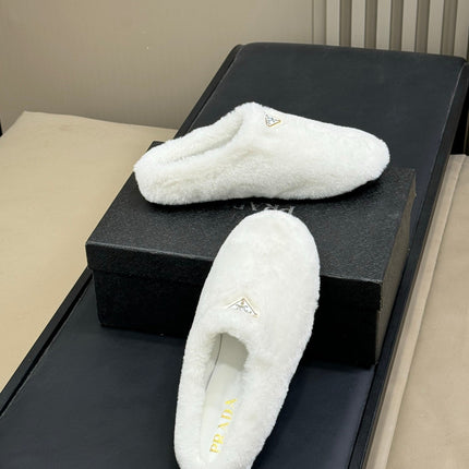 PRADA 25S CLOGS IN WHITE SHEARLING