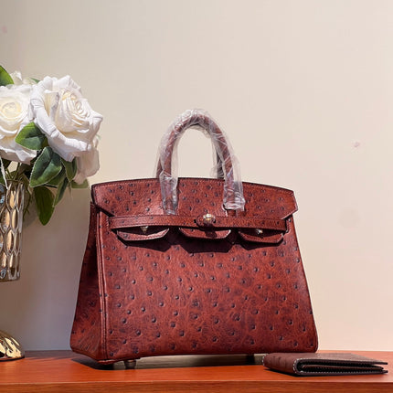 KELLY SELLIER 25 BAG IN BERRY RED OSTRICH LEATHER WITH GOLD HARDWARE
