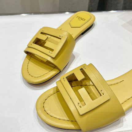 FENDI BAGUETTE SLIDES IN BRIGHT YELLOW LAMBSKIN