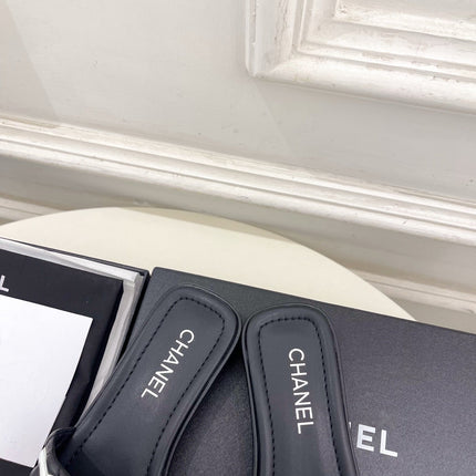 CHANEL 26S FLAT SLIDES IN BLACK LAMBSKIN WITH WHITE CC LOGO
